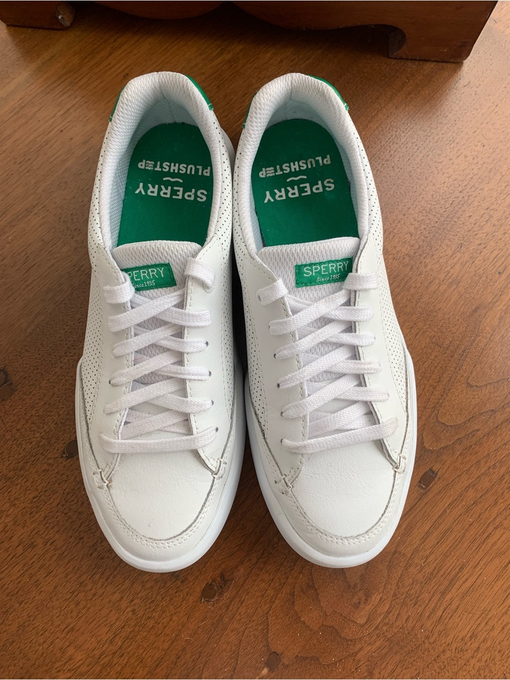 Like New! Sperry White Leather Lace-Up Sneakers with Green accent on heel.